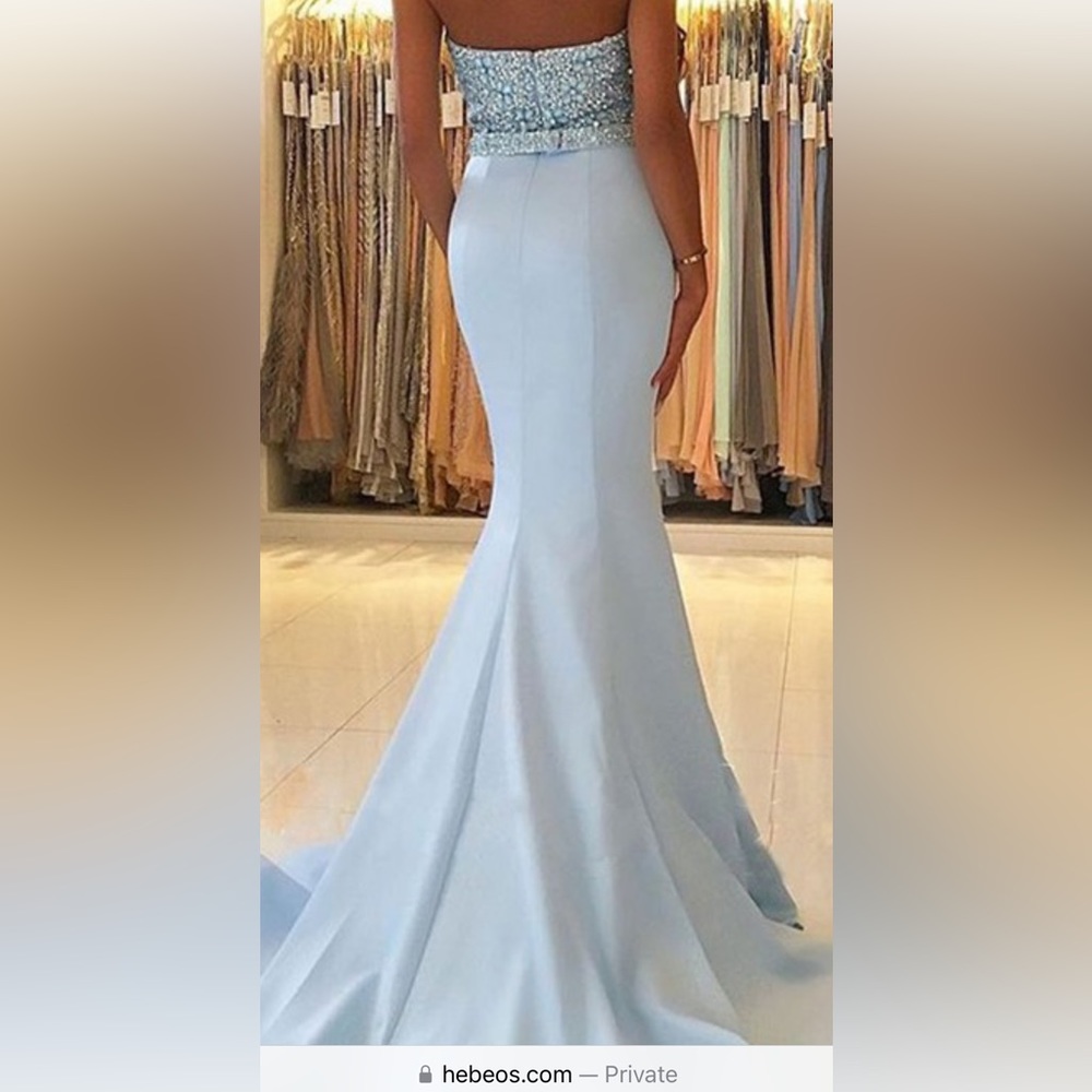 Brand new never worn Ice blue mermaid prom dress with beading and stones. Size 2